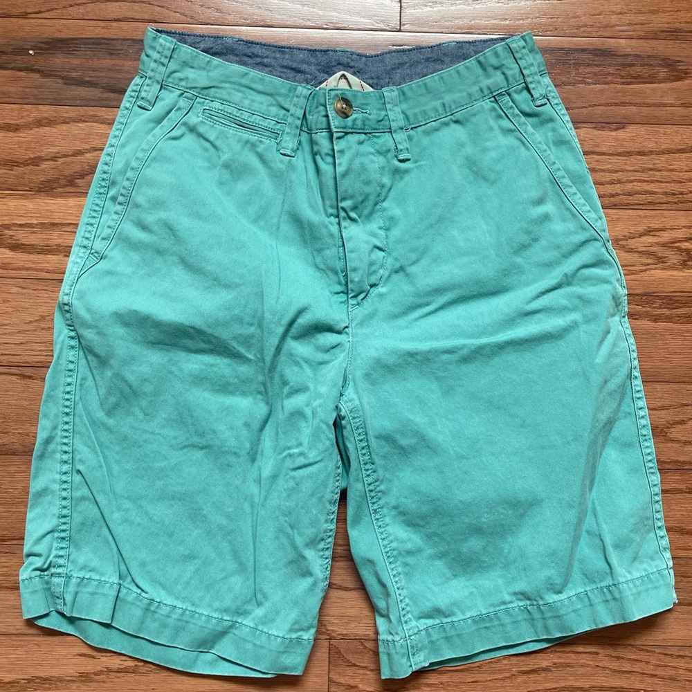 Classic fit. Turquoise 
Belt loops. Zip fly with a buttoned closure.